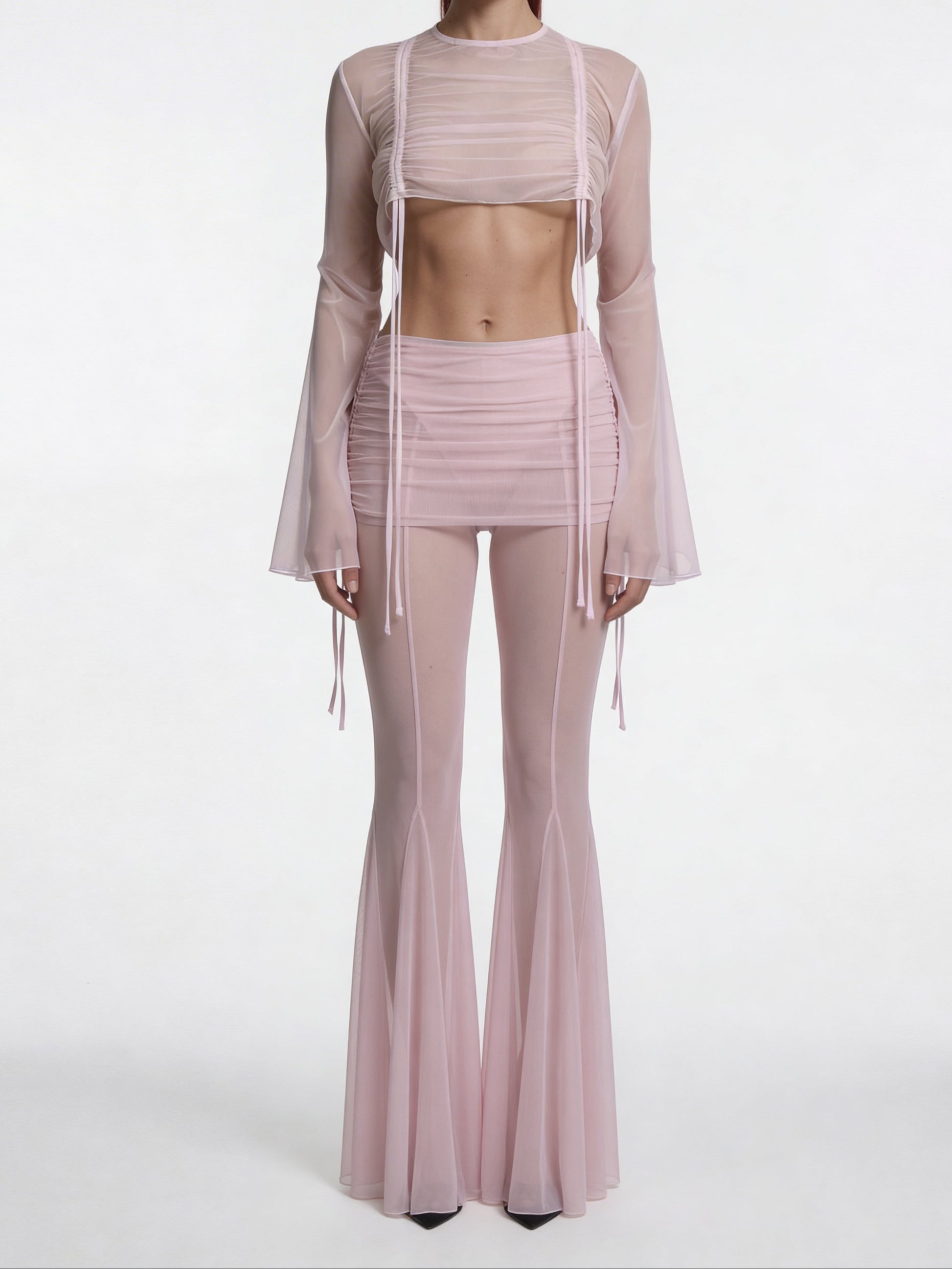 Model wearing  Alevy Studios  light pink drawstring trousers 